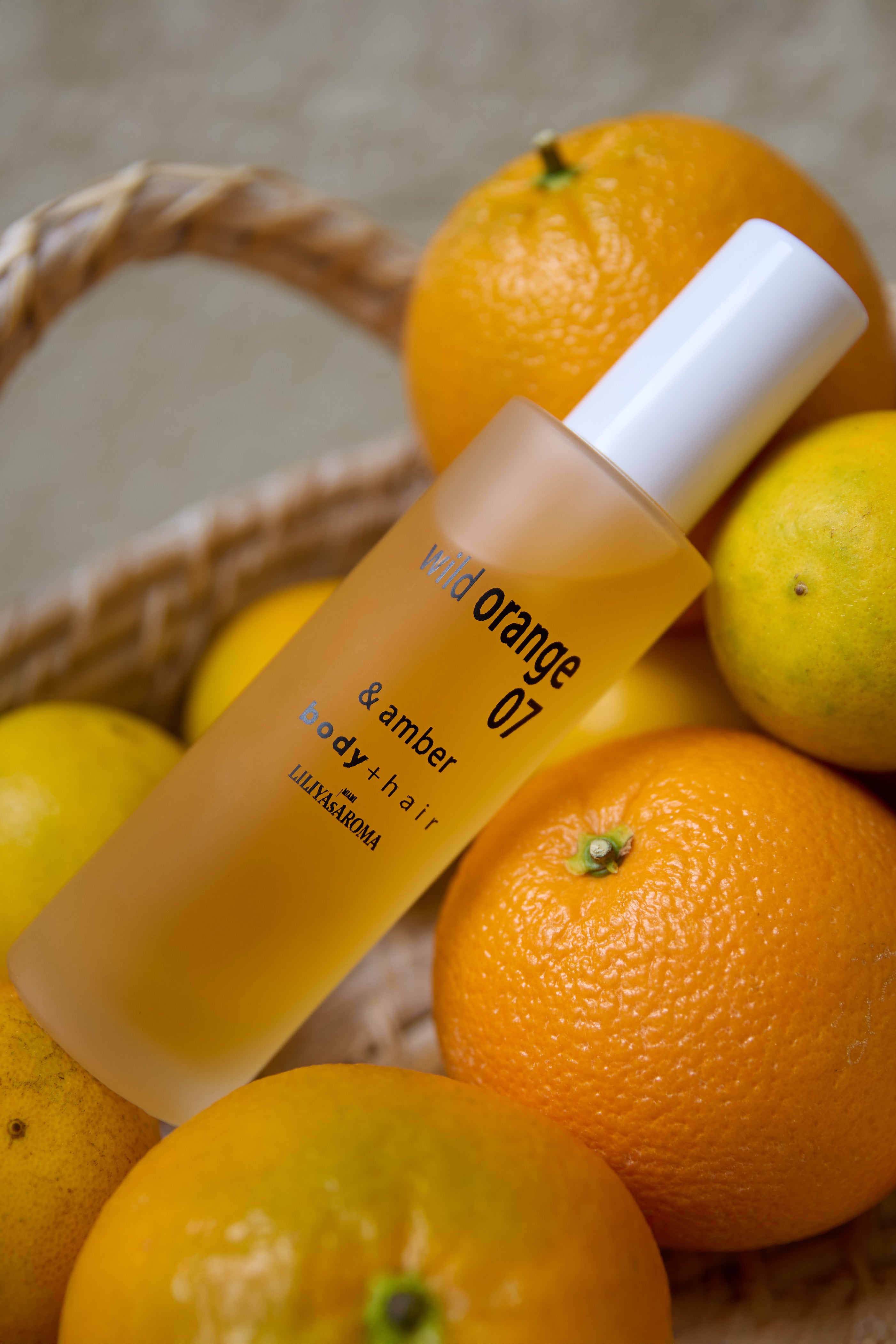 Wild Orange 07 & Amber — a radiant citrus body mist with orange, neroli, and soft amber warmth.